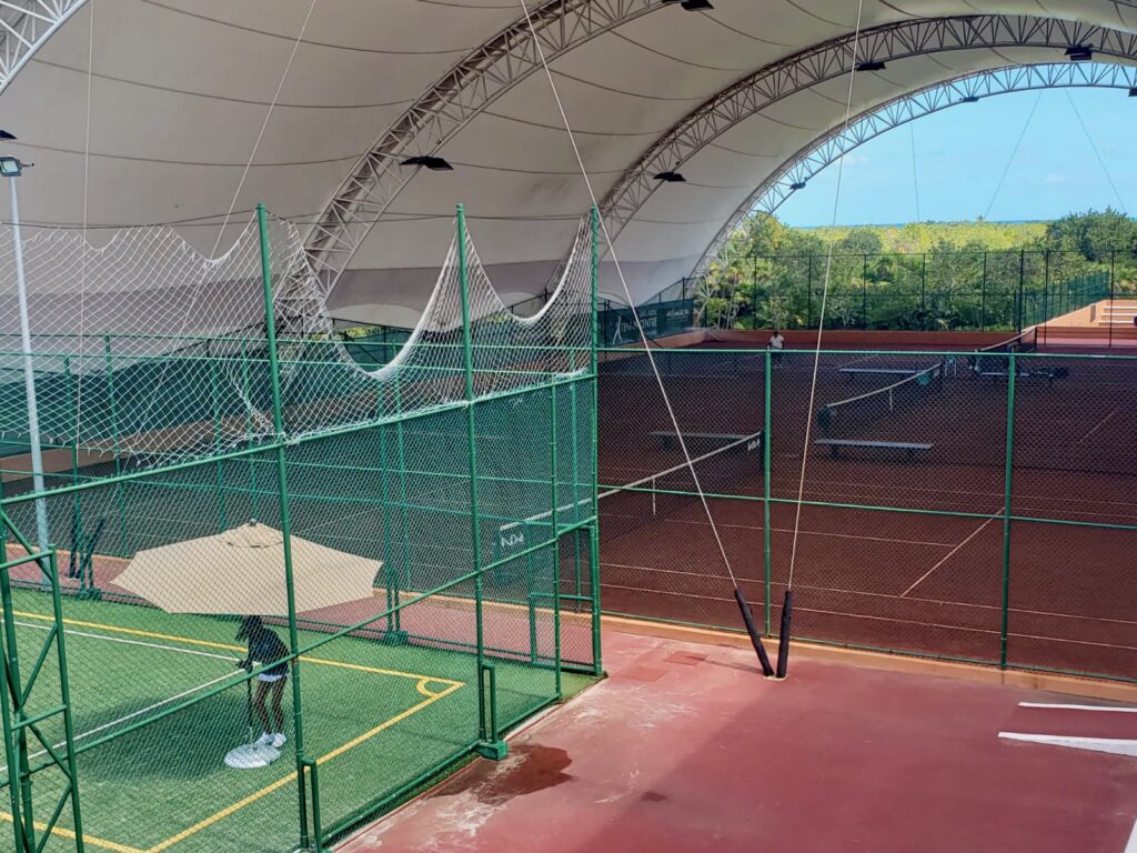 tennis tourist rafa nadal center cancun clay courts fence michelle j